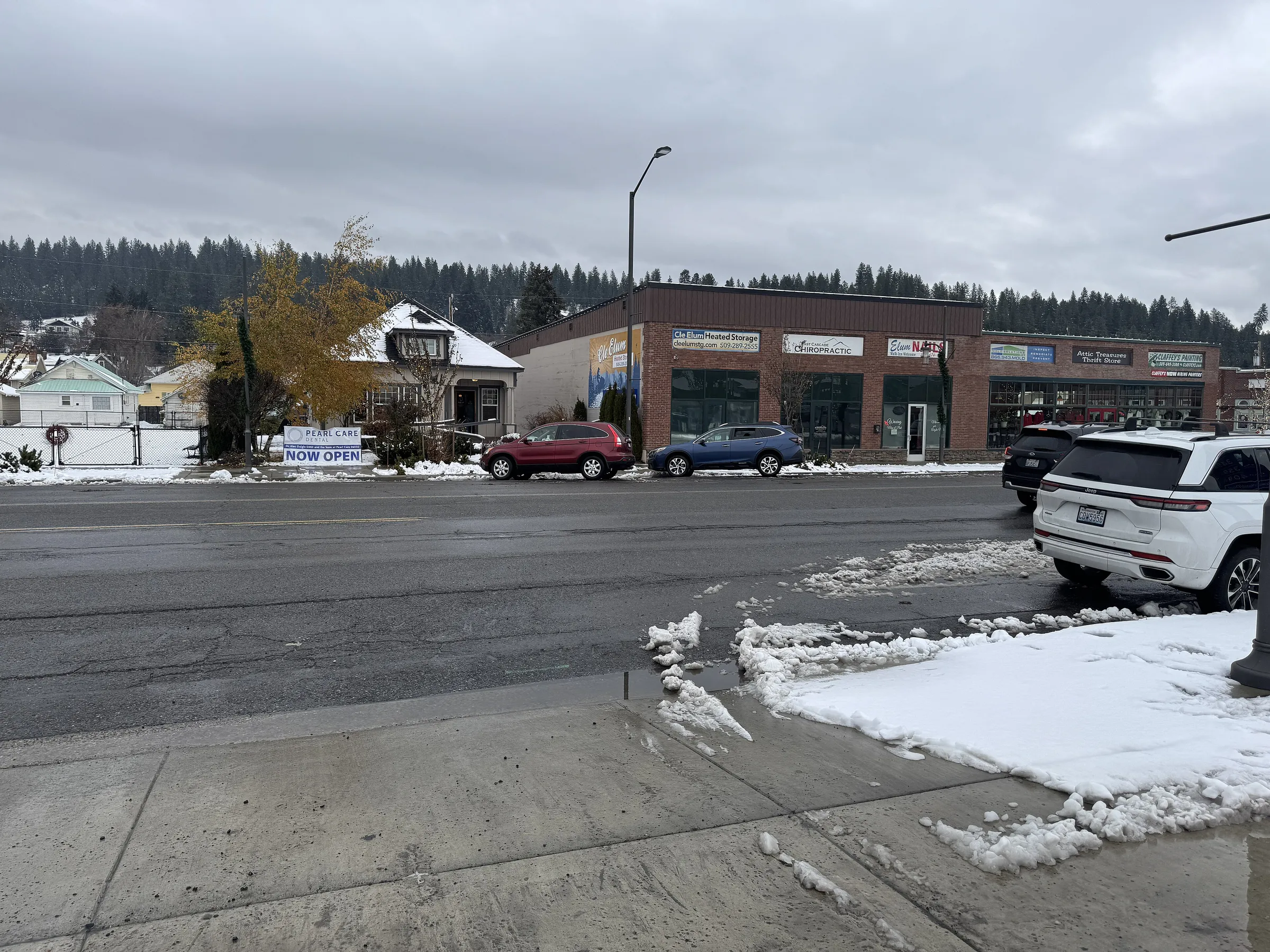 First Street in Cle Elum after a snowfall, snow piled along the curb